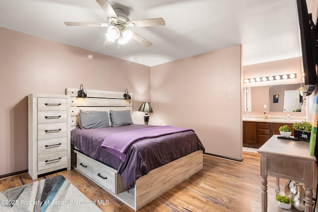 18 Angelica Cir, Parachute, CO 81635 - bedroom with light wood-style flooring, connected bathroom, and ceiling fan