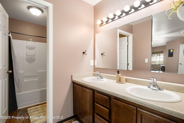 18 Angelica Cir, Parachute, CO 81635 - full bath with double vanity, wood finished floors, and shower / tub combo