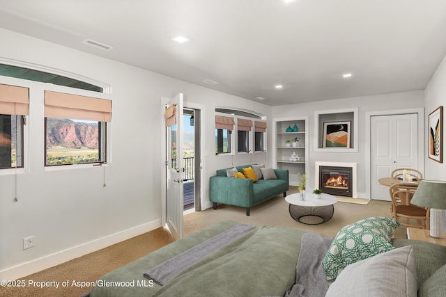 587 Hillcrest Dr, Basalt, CO 81621 - carpeted office with plenty of natural light, baseboards, and a fireplace with flush hearth