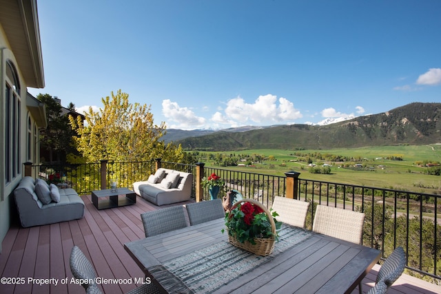 587 Hillcrest Dr, Basalt, CO 81621 - wooden terrace featuring outdoor lounge area, a mountain view, and outdoor dining space