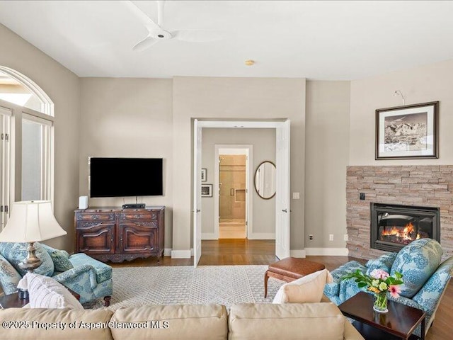 587 Hillcrest Dr, Basalt, CO 81621 - living room with wood finished floors, a fireplace, baseboards, and a ceiling fan