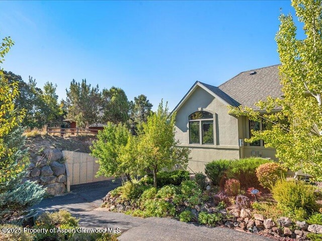 587 Hillcrest Dr, Basalt, CO 81621 - view of home's exterior with stucco siding and a shingled roof