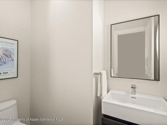 587 Hillcrest Dr, Basalt, CO 81621 - bathroom featuring toilet and a sink