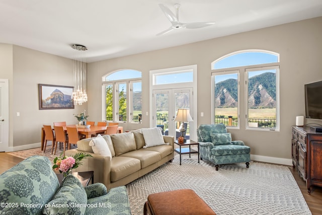 587 Hillcrest Dr, Basalt, CO 81621 - living area with baseboards, wood finished floors, and a chandelier