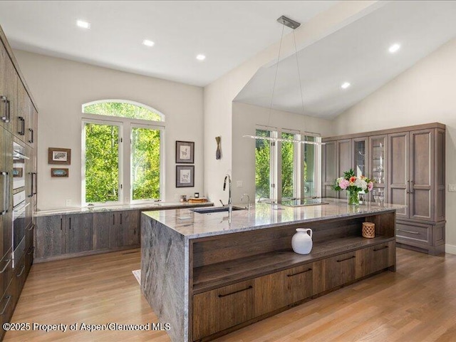 587 Hillcrest Dr, Basalt, CO 81621 - kitchen with a sink, light wood-style flooring, plenty of natural light, light stone counters, and recessed lighting