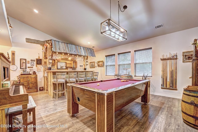 rec room featuring hardwood / wood-style flooring, lofted ceiling, and billiards