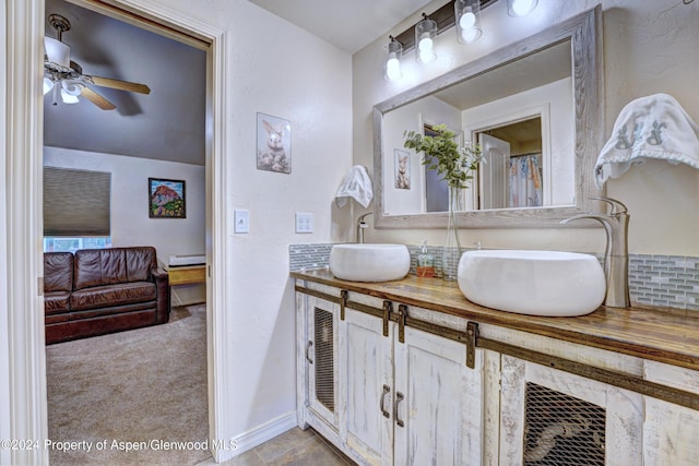 bathroom featuring ceiling fan and vanity