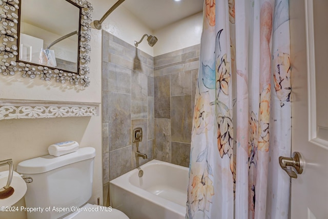 bathroom with toilet and shower / tub combo with curtain