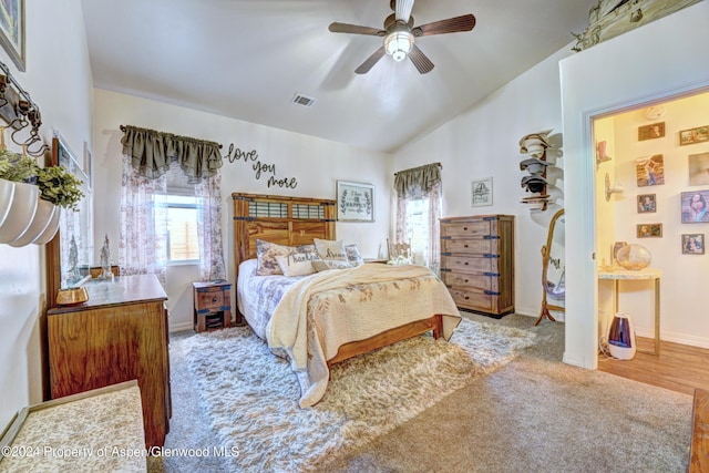 carpeted bedroom featuring ceiling fan and lofted ceiling