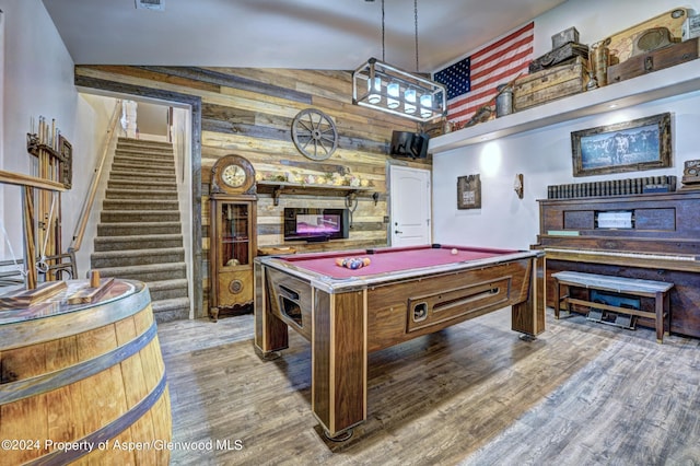 recreation room with hardwood / wood-style floors, billiards, vaulted ceiling, and wood walls