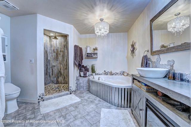 full bathroom featuring shower with separate bathtub, vanity, toilet, and a notable chandelier