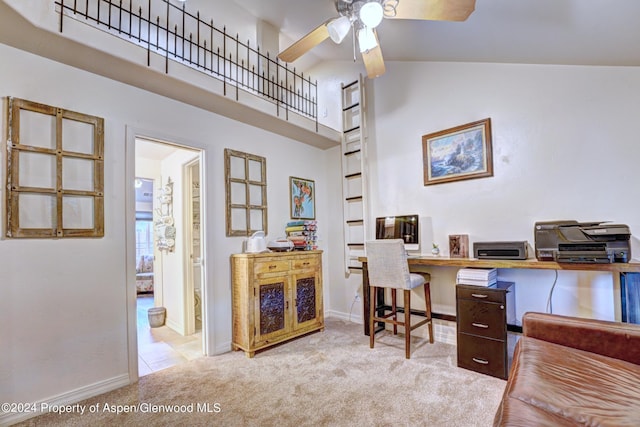 carpeted office space featuring ceiling fan