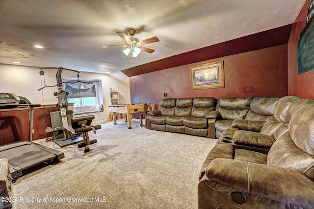 carpeted living room featuring ceiling fan and vaulted ceiling