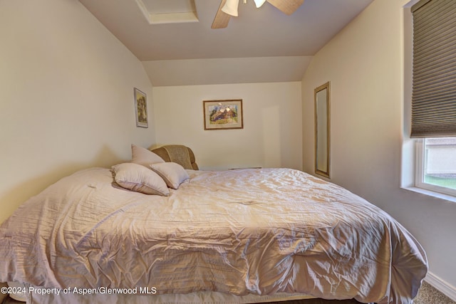 bedroom with carpet flooring, ceiling fan, and lofted ceiling