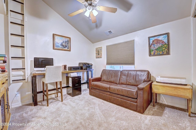 office area featuring ceiling fan, light colored carpet, and vaulted ceiling