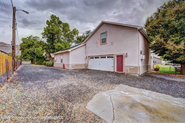 view of side of home with a garage