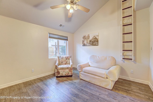 living area featuring ceiling fan, high vaulted ceiling, and hardwood / wood-style flooring