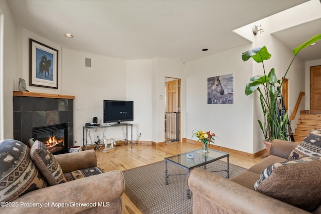 1459 County Road 102, Carbondale, CO 81623 - living room with a tiled fireplace and hardwood / wood-style floors