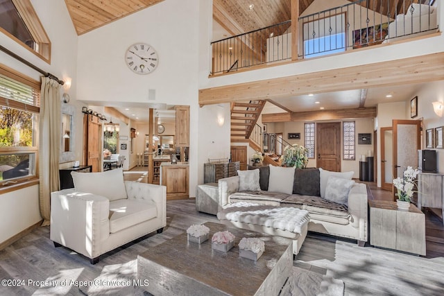 living room featuring hardwood / wood-style floors, high vaulted ceiling, and wooden ceiling