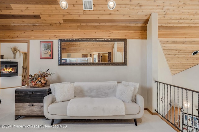 sitting room with lofted ceiling and wooden ceiling