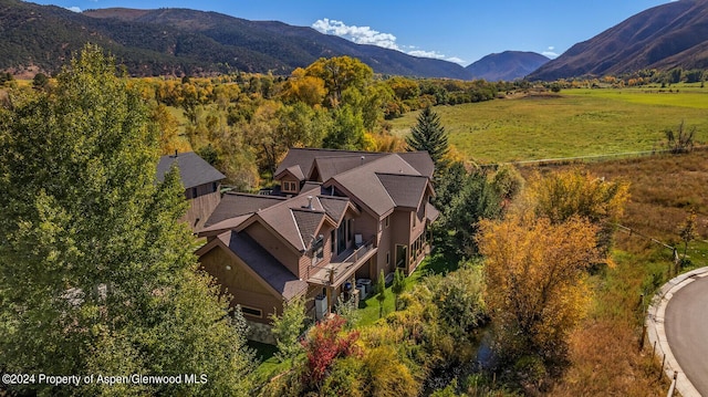 birds eye view of property featuring a mountain view