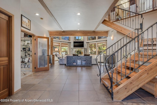 stairs with tile patterned flooring and french doors