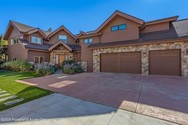 craftsman-style home with a garage