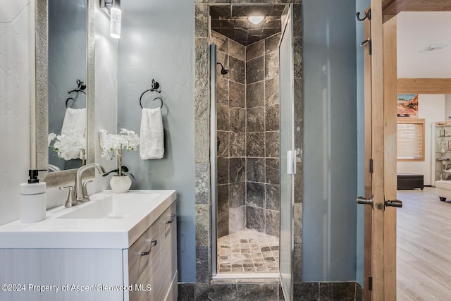 bathroom with vanity and an enclosed shower