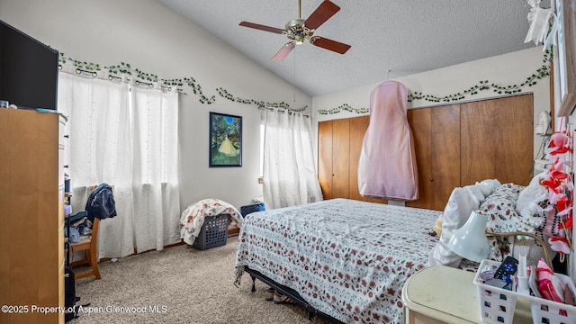 500 Fairway Ave, Rifle, CO 81650 - carpeted bedroom featuring a textured ceiling, vaulted ceiling, and ceiling fan