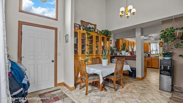 500 Fairway Ave, Rifle, CO 81650 - dining room with a high ceiling, a chandelier, ceiling fan, and baseboards