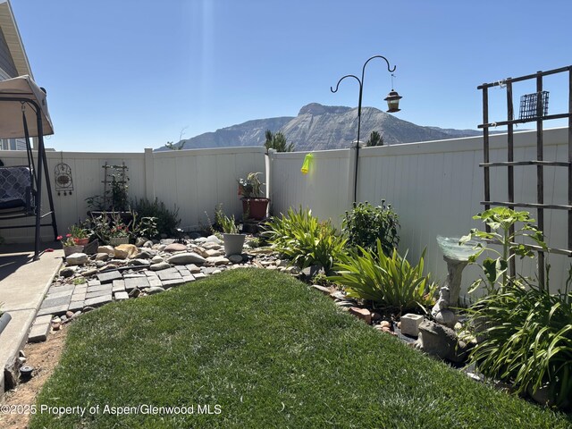 19 Angelica Cir, Parachute, CO 81635 - fenced backyard featuring a mountain view
