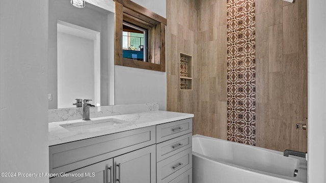 bathroom featuring vanity and shower / bathtub combination