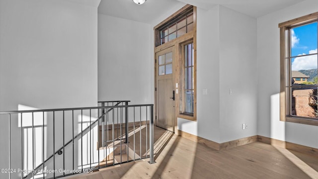 hall with wood-type flooring