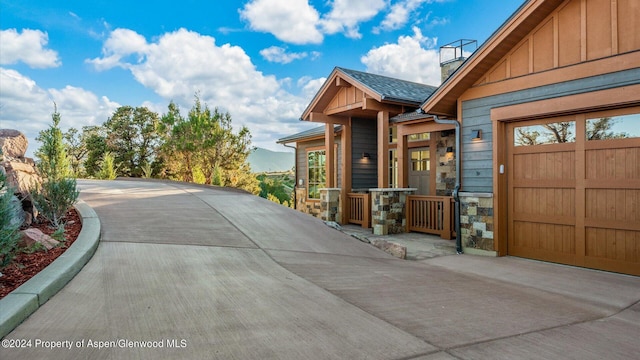 exterior space with a mountain view and a garage