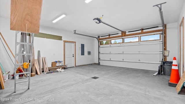 garage featuring electric panel and a garage door opener