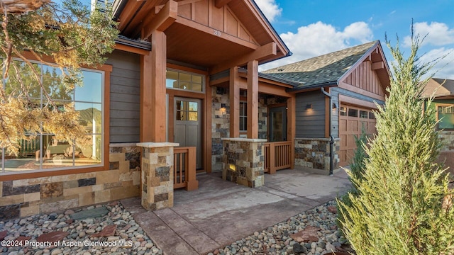 view of exterior entry featuring a garage