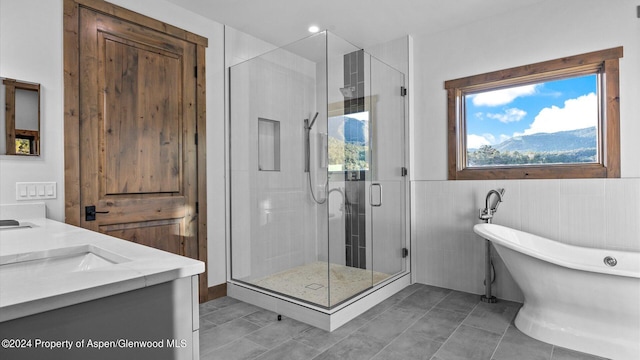 bathroom with plenty of natural light, vanity, independent shower and bath, and tile patterned flooring