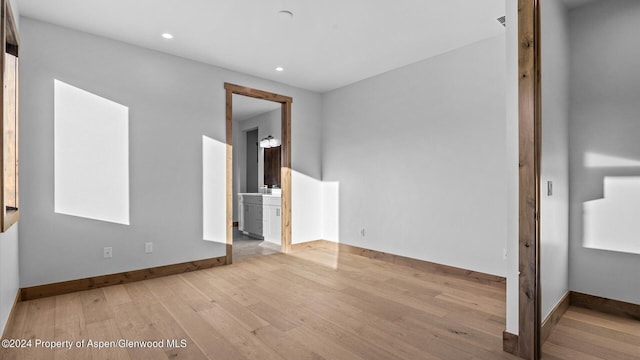 unfurnished room with light hardwood / wood-style flooring