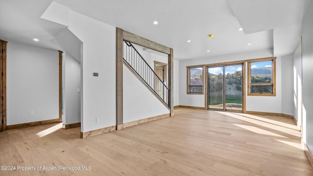 unfurnished living room with light hardwood / wood-style floors