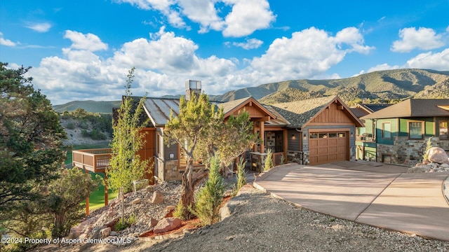 view of front of house with a mountain view and a garage