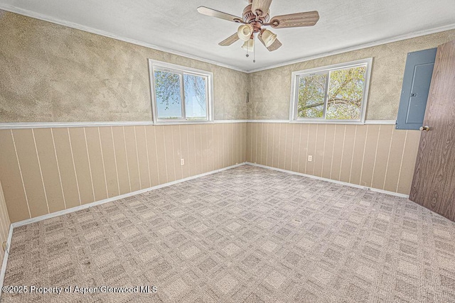 5990 County Road 7, Craig, CO 81625 - spare room featuring electric panel, healthy amount of natural light, ceiling fan, ornamental molding, and baseboards
