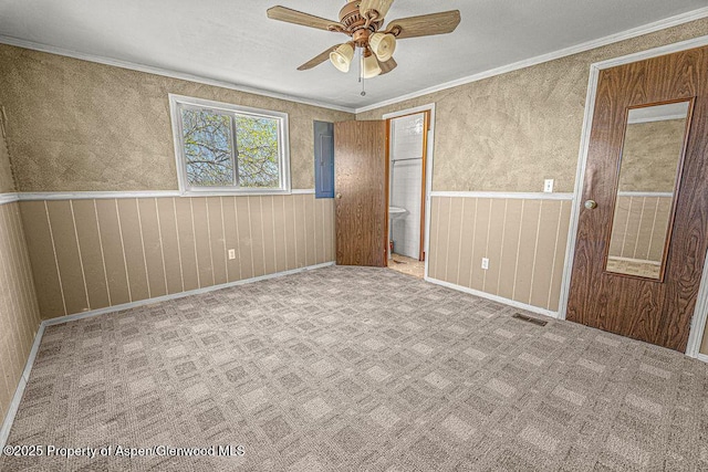 5990 County Road 7, Craig, CO 81625 - unfurnished bedroom featuring crown molding, electric panel, a ceiling fan, and baseboards