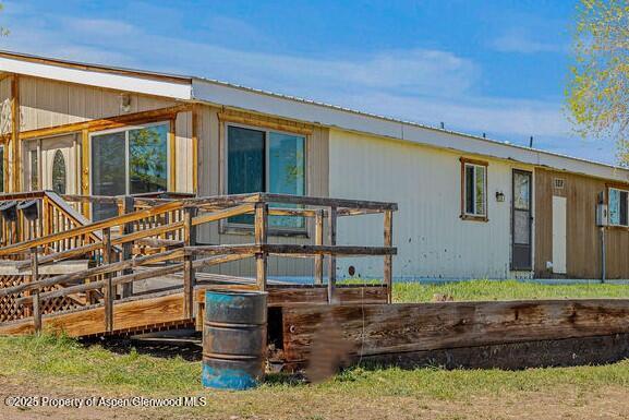 5990 County Road 7, Craig, CO 81625 - view of side of home