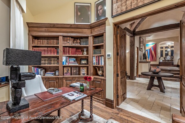 office space featuring high vaulted ceiling