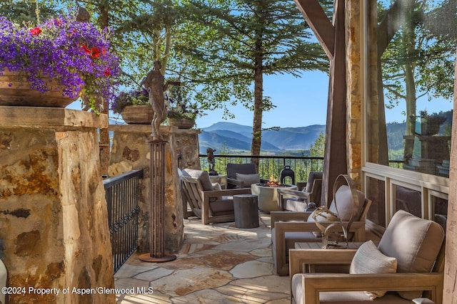 view of patio featuring outdoor lounge area and a mountain view