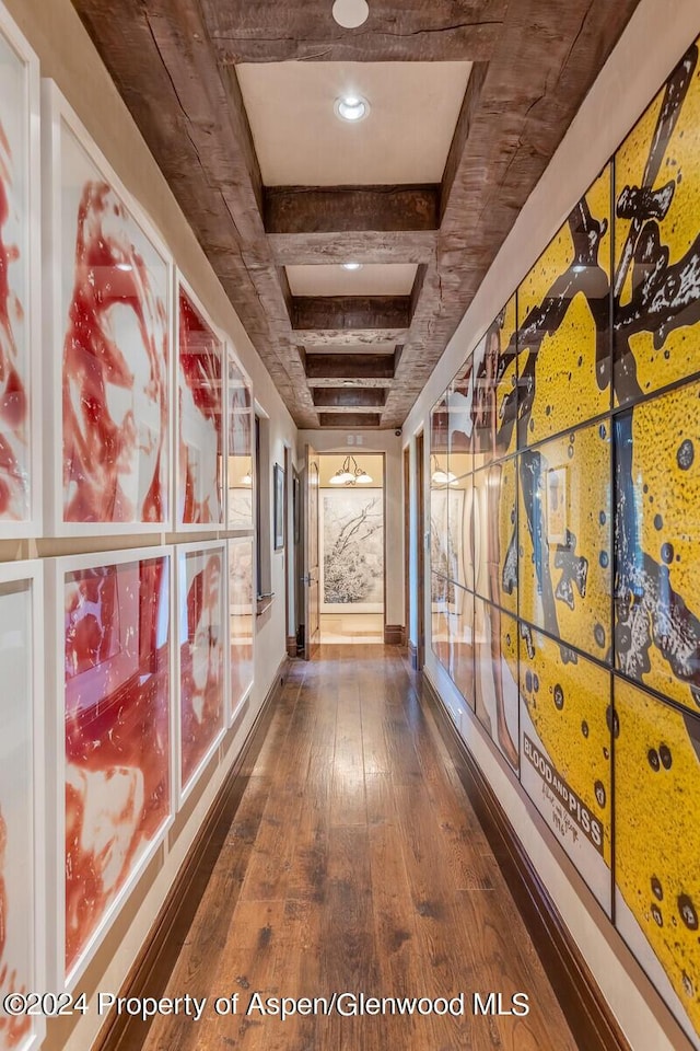 corridor featuring dark hardwood / wood-style flooring and coffered ceiling