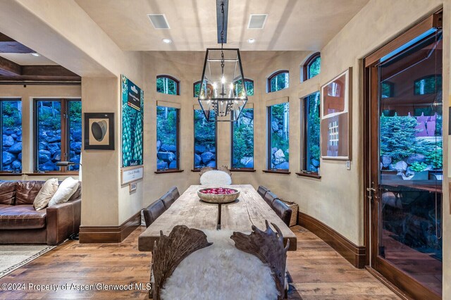 dining space featuring a chandelier and hardwood / wood-style floors