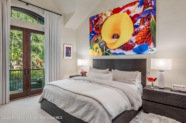 bedroom with vaulted ceiling, access to exterior, carpet floors, and french doors