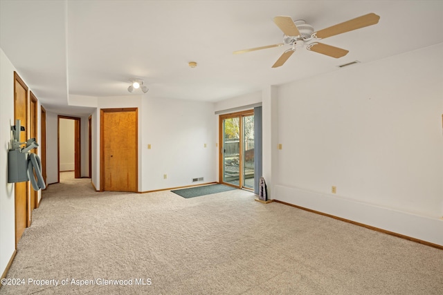 unfurnished room with light carpet and ceiling fan