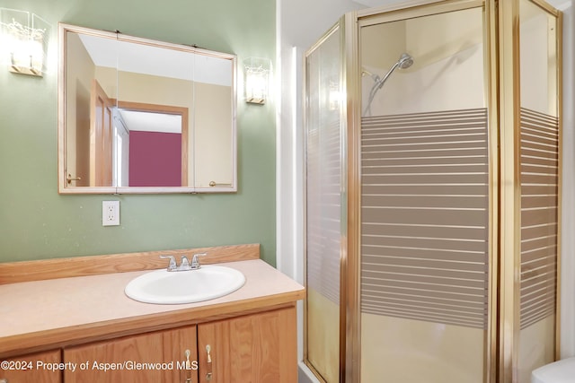 bathroom with vanity and an enclosed shower